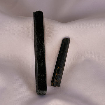 Aegirine crystal cluster with deep black luster displayed against a neutral background