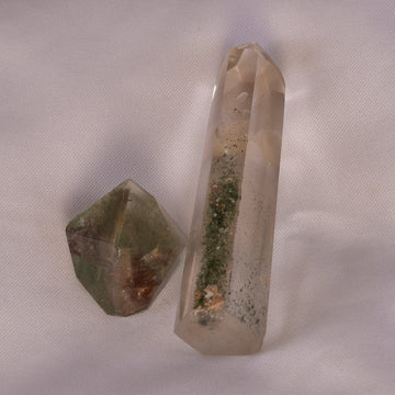 Chlorite Quartz crystal showcasing its natural green inclusions, perfect for healing and spiritual purification.