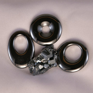 Shiny, metallic Hematite crystal, symbolizing strength, stability, and grounding energy.