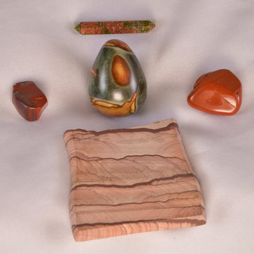 Assorted collection of Jasper stones, showcasing a spectrum of colors and patterns, symbolizing spiritual growth and balance.