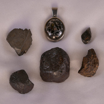Assorted collection of meteorites, showcasing the ethereal beauty of Chondrite, Nickel/Iron, and Pallasite, each embodying cosmic energy and wisdom.