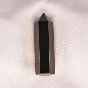 Deep black Onyx crystal, symbolizing strength and protection, perfect for grounding and clarity.
