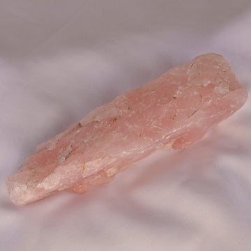 Soft pink Rose Quartz crystal, symbolizing love and emotional healing.