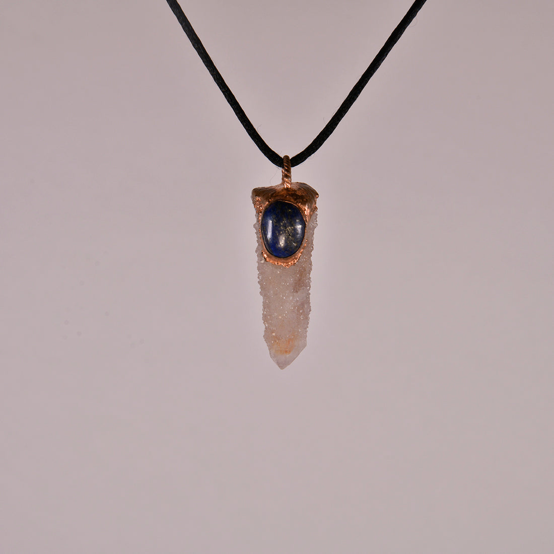 "Handcrafted copper electroformed pendant featuring a stunning Spirit Quartz and deep blue Lapis Lazuli crystal, perfect for esoteric and spiritual jewelry enthusiasts."
