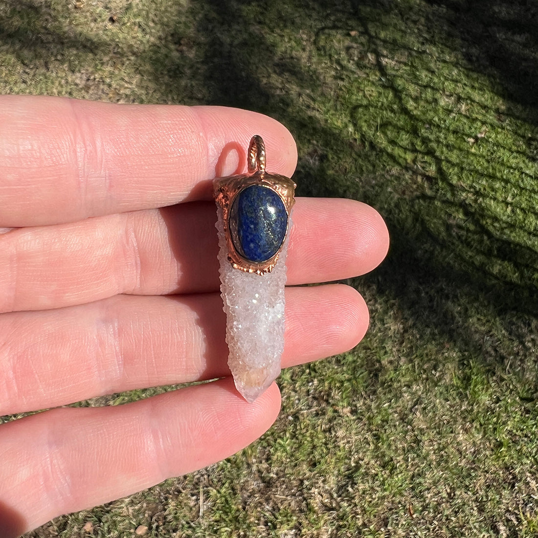 "Handcrafted copper electroformed pendant featuring a stunning Spirit Quartz and deep blue Lapis Lazuli crystal, perfect for esoteric and spiritual jewelry enthusiasts."