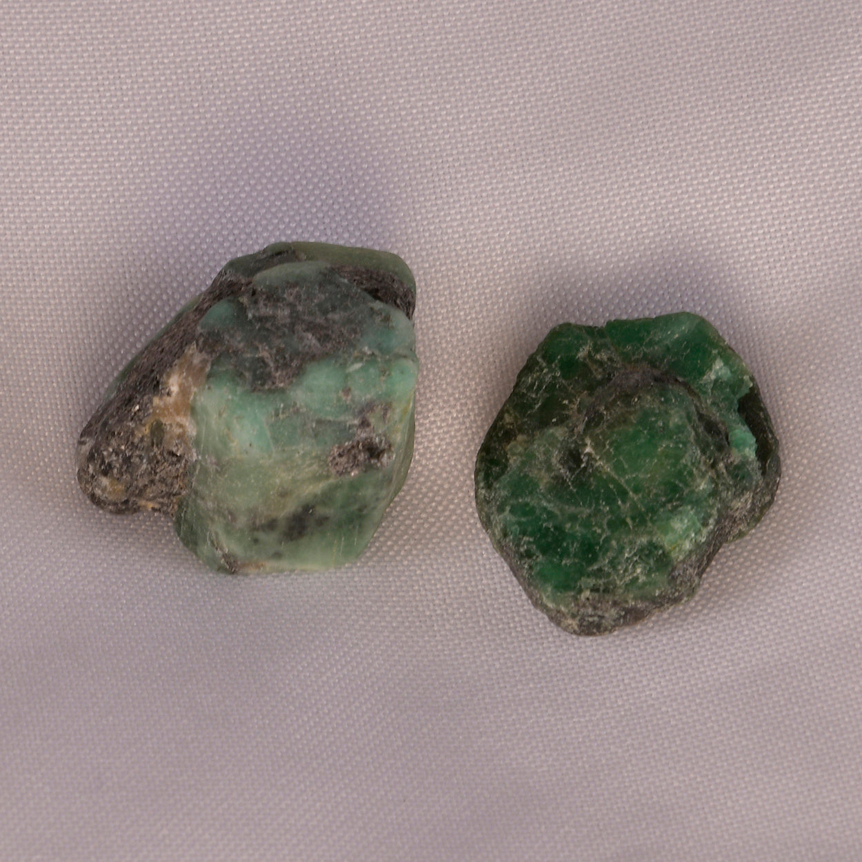 Lush green Emerald crystal, radiating soothing energy and symbolizing love, wisdom, and abundance.