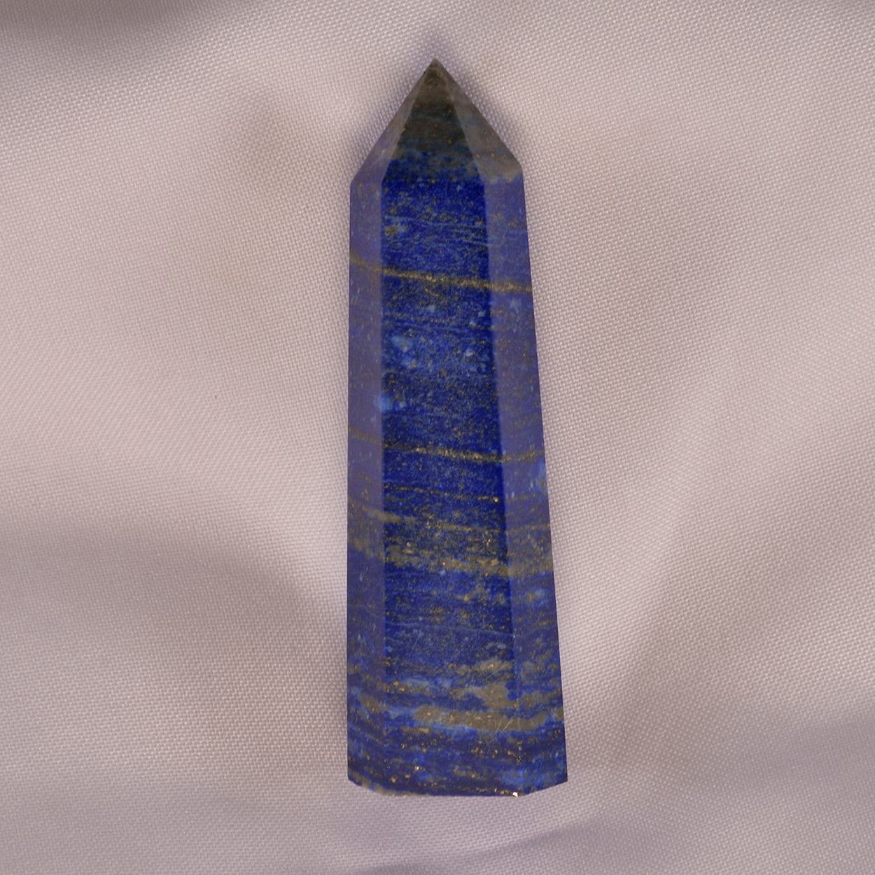 Rich, deep blue Lapis Lazuli stone, flecked with golden pyrite, symbolizing wisdom, truth, and spiritual enlightenment.