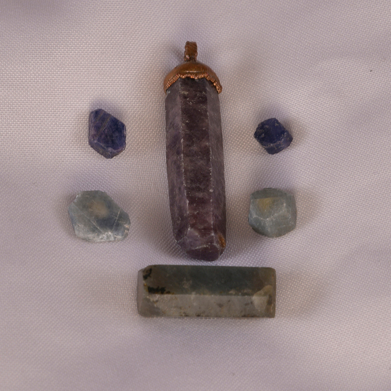Collection of Sapphire gemstones in various colors, each radiating unique energy.