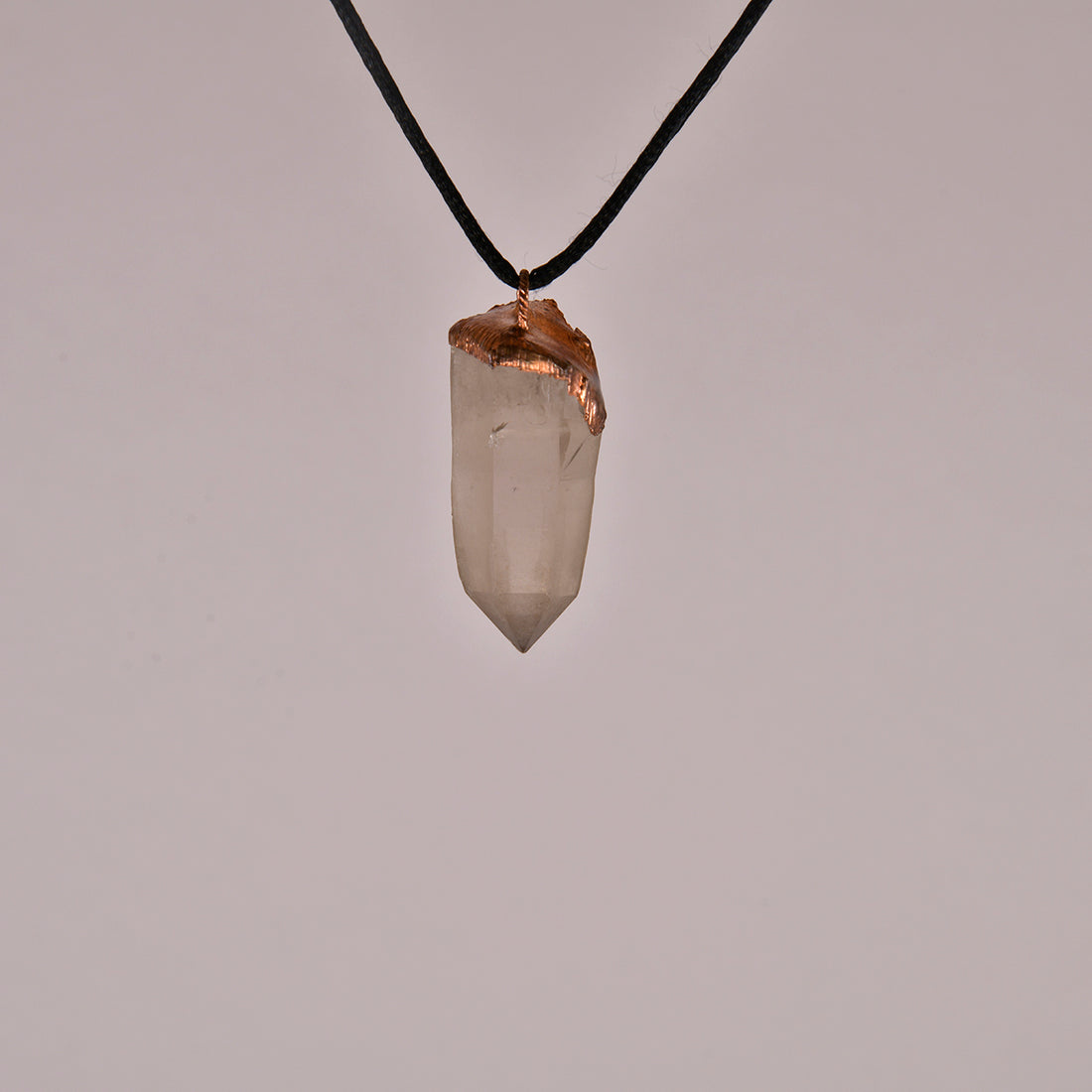 "Handcrafted copper electroformed pendant featuring a polished smoky quartz crystal, emitting grounding and protective energy. Unique esoteric jewelry piece for spiritual and healing purposes."