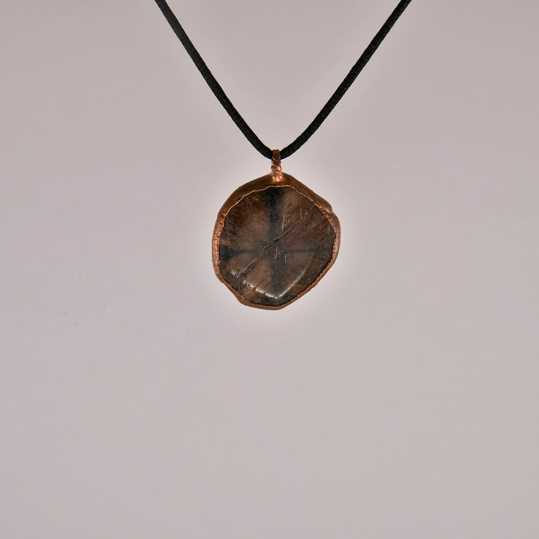 "Handcrafted copper electroformed pendant featuring an esoteric andalusite crystal, designed for spiritual healing and metaphysical energy alignment."
