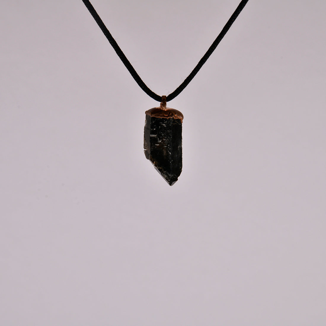 "Handcrafted copper electroformed pendant featuring a Skeletal Smoky Quartz crystal, known for its esoteric healing properties. Unique, one-of-a-kind jewellery piece for spiritual enthusiasts."