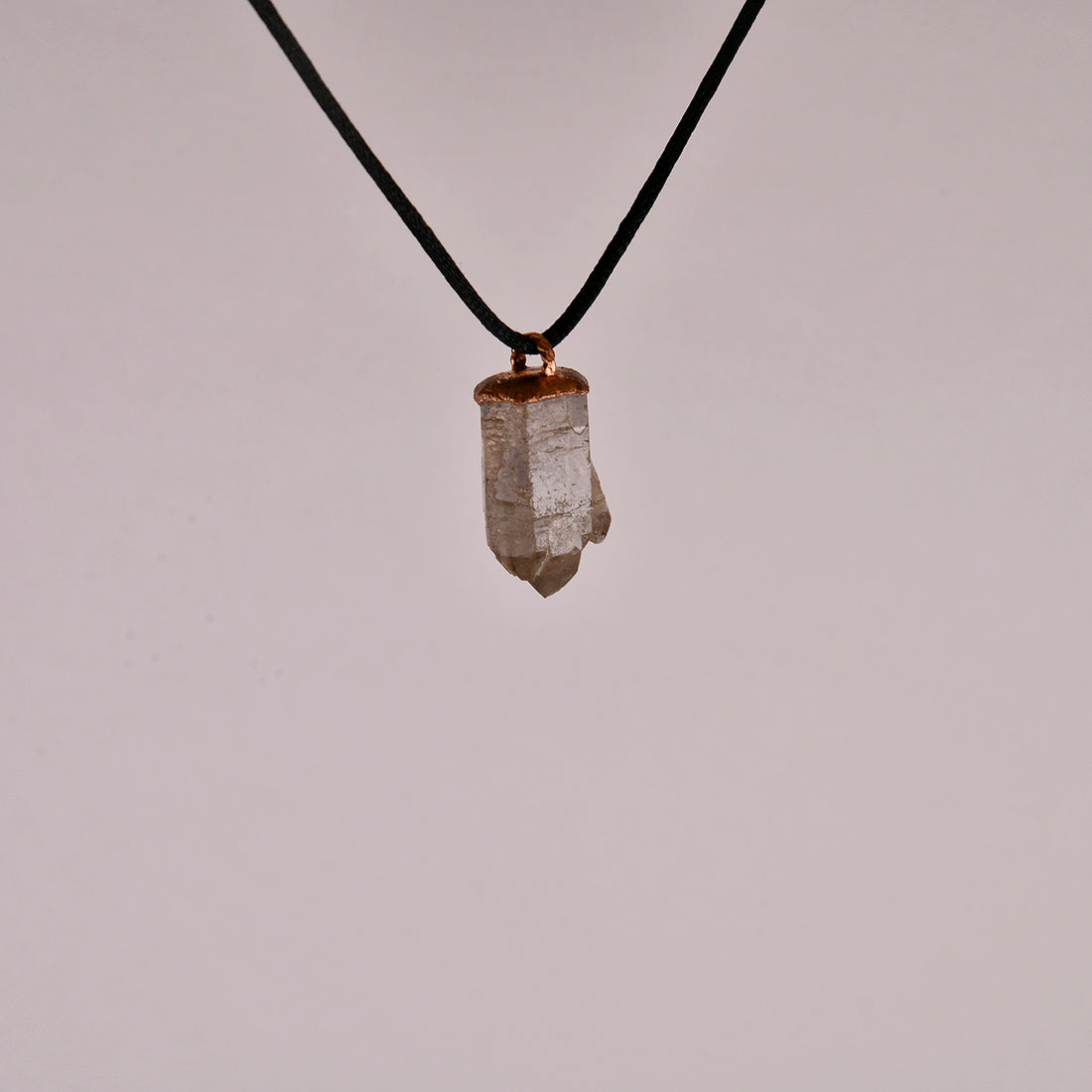 "Handcrafted copper electroformed pendant featuring a polished smoky quartz crystal, emitting grounding and protective energy. Unique esoteric jewelry piece for spiritual and healing purposes."