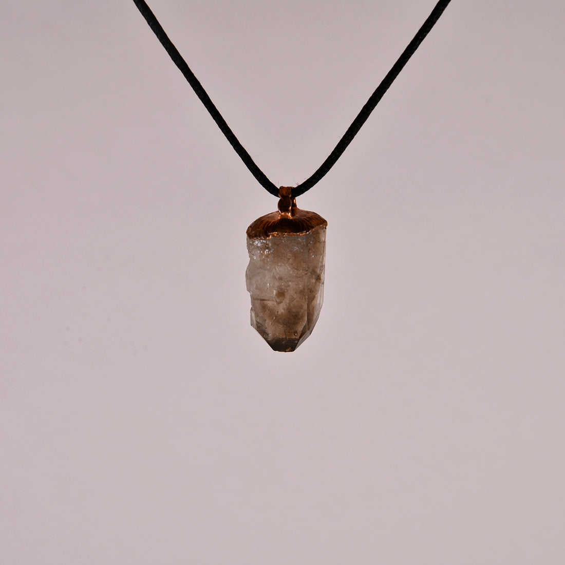 "Handcrafted copper electroformed pendant featuring a Skeletal Smoky Quartz crystal, known for its esoteric healing properties. Unique, one-of-a-kind jewellery piece for spiritual enthusiasts."