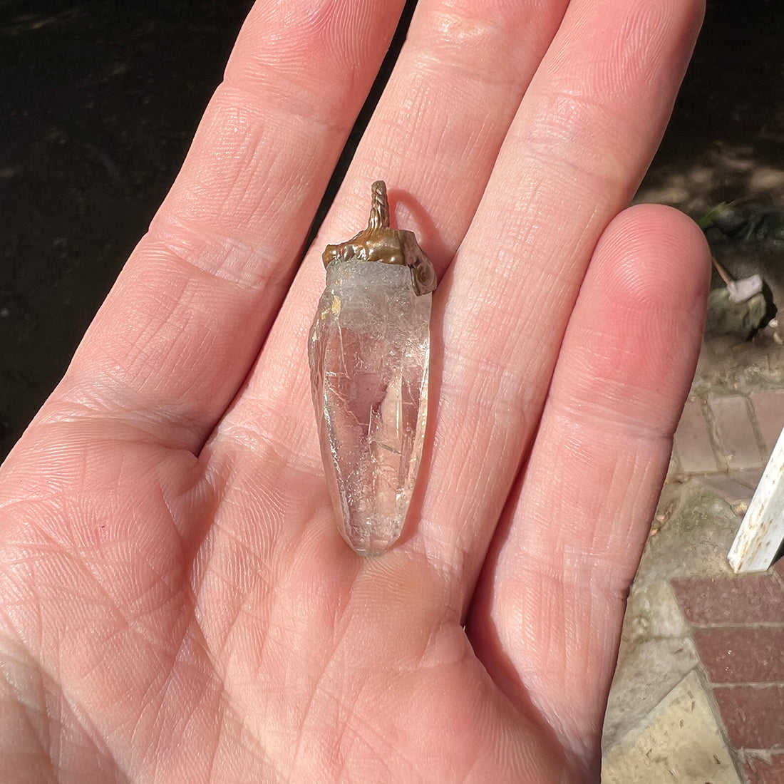 "Handcrafted copper electroformed pendant featuring a polished smoky quartz crystal, emitting grounding and protective energy. Unique esoteric jewelry piece for spiritual and healing purposes."