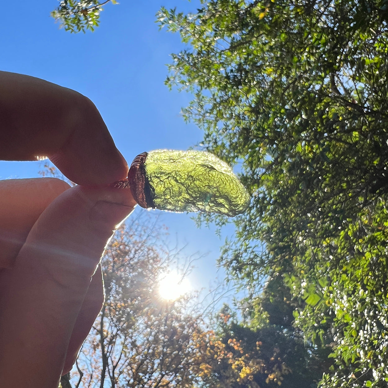 "Handcrafted copper electroformed Moldavite pendant by Star Das Creations, featuring a unique esoteric design with natural Moldavite crystal."