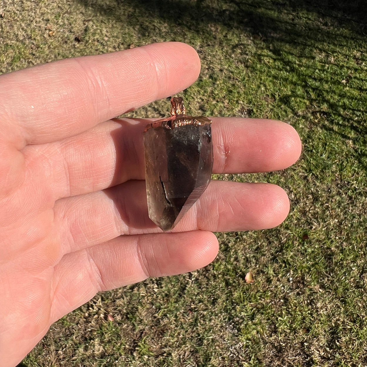 "Handcrafted copper electroformed pendant featuring Smoky Quartz and Aegirine crystals from Star Das Creations. Unique esoteric jewellery combining grounding Smoky Quartz and protective Aegirine. Perfect for crystal healing and spiritual enhancement."