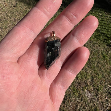 "Handcrafted copper electroformed pendant featuring a Skeletal Smoky Quartz crystal, known for its esoteric healing properties. Unique, one-of-a-kind jewellery piece for spiritual enthusiasts."